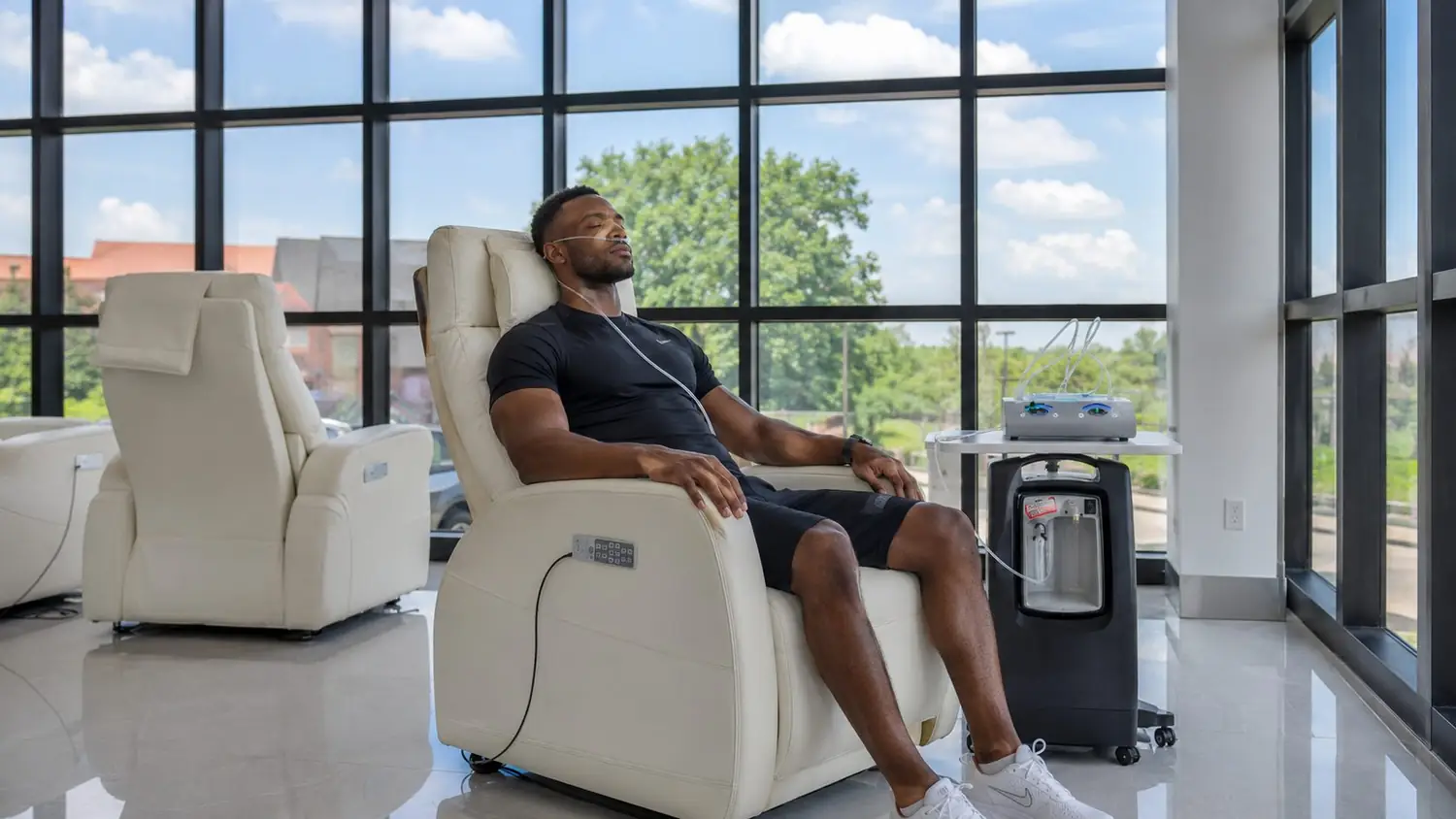 A client relaxing in a recliner at the oxygen bar