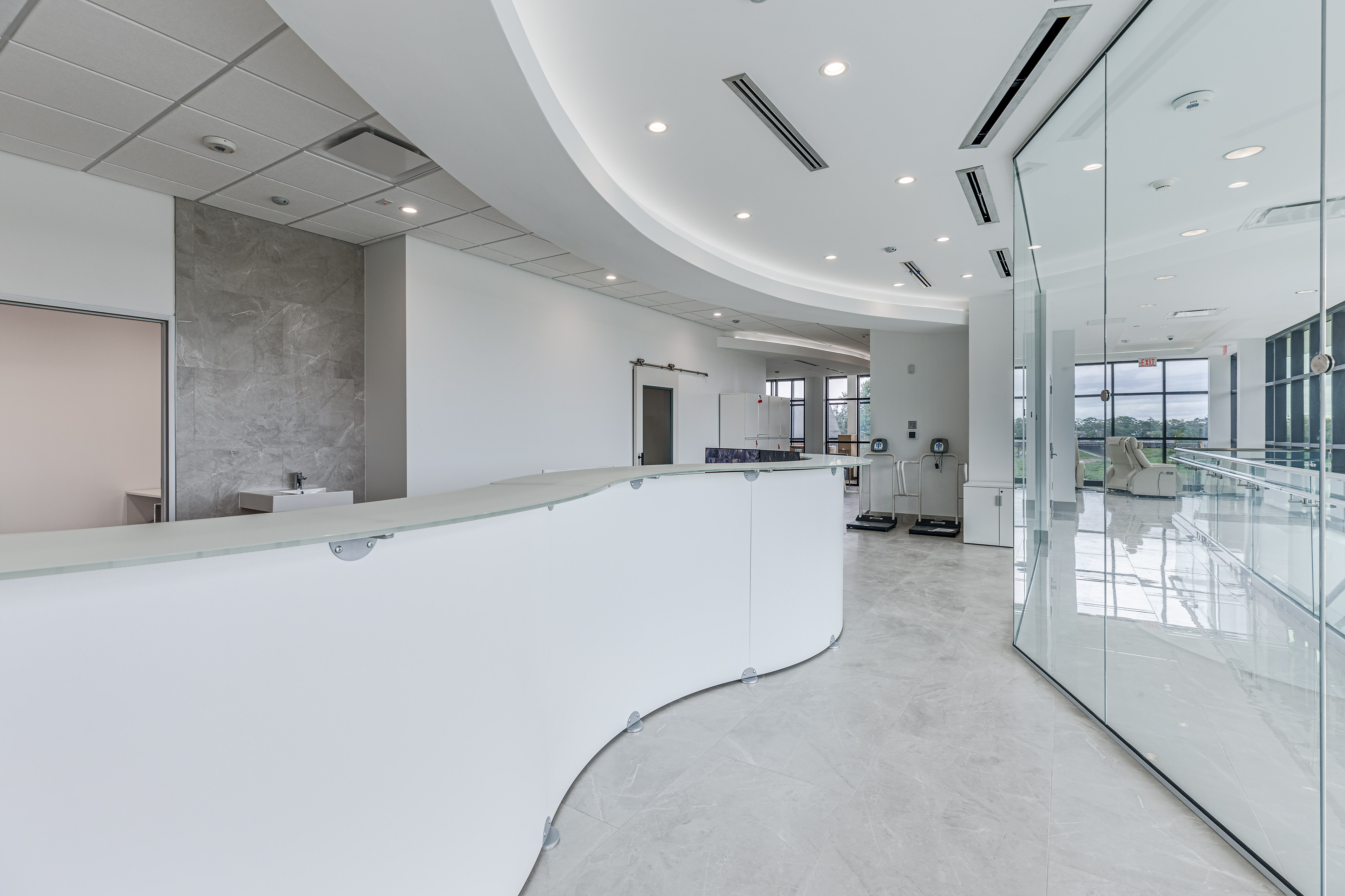 Curved white reception desk at the HealthCo infusion center